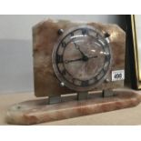 A vintage alabaster mantle clock fitted with later quartz movement.