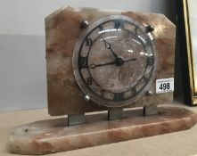 A vintage alabaster mantle clock fitted with later quartz movement.