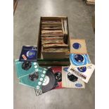 A box of 1960's 45 rpm records, Elvis, Cliff Richard etc.