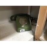 A vintage green telephone.