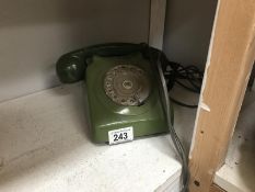 A vintage green telephone.