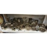 A good mixed lot of silver plate including cruets, spill vases, tankards, dishes etc.