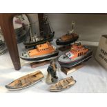 3 lifeboat models, a trawler and 2 dinghies.