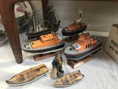 3 lifeboat models, a trawler and 2 dinghies.