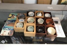 11 Japanese sake's bowls in tray together with Japanese design coasters.