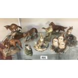 A collection of Border fine arts and other animal figures.