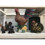 A quantity of chicken and cockerel ornaments including cast iron and glass lantern.