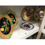 A pair of fruit decorated Staffordshire plates, a pair of Falcon ware tulip plates and 1 other.