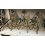 7 decorative brass easels.