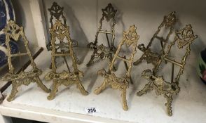 7 decorative brass easels.