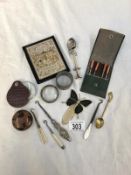 A mixed lot of metal items including button hooks, a spoon, napkin ring etc.