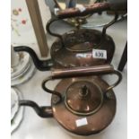 2 Victorian copper kettles and a modern brass shaving mirror.