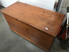 A large pine blanket box.