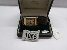 A 9ct gold art deco gent's oblong wrist watch, in working order.