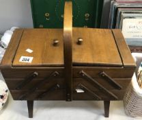 A concertina sewing box and contents.