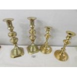 2 pairs of brass candlesticks.