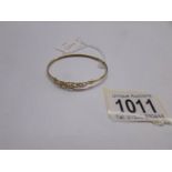 A 9ct gold bangle weighing 3 grams.