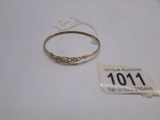 A 9ct gold bangle weighing 3 grams.