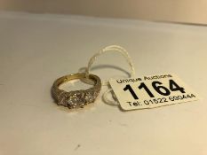 A 14ct gold ring set with 3 white stones, marked 585, Size T.