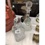 2 crystal decanters with 3 porcelain labels.