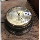 A brass ships style barometer.