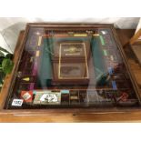 A fabulous collector's edition cased monopoly set with glass lid.