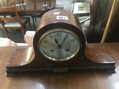 An inlaid Napoleon style clock.