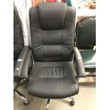 A black leather office chair.