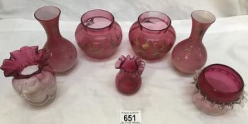 A mixed lot of cranberry glass including bird decorated pots and a pair of pink glass vases.