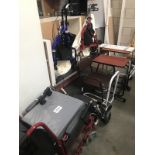 A wheelchair, 2 walking aids and other items.