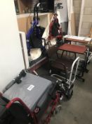 A wheelchair, 2 walking aids and other items.