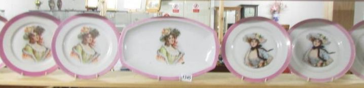 A Bavarian porcelain sandwich set comprising platter and 6 plates with portraits of ladies.