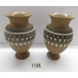 A pair of Doulton Lambeth stoneware vases.