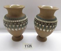 A pair of Doulton Lambeth stoneware vases.