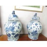 A large pair of late 20th century blue and white Chinese lidded vases.