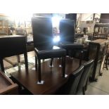 6 leatherette dining chairs and a dining table.