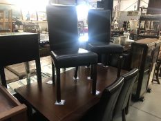 6 leatherette dining chairs and a dining table.