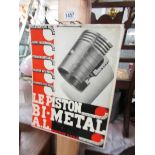 A vintage French piston advertising sign.