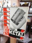 A vintage French piston advertising sign.