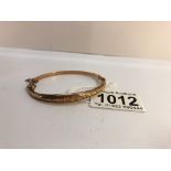 A 9ct gold bangle with safety chain weight 6 grams and bearing a Birmingham hall mark.