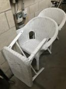 A pair of white painted loom chairs with table.