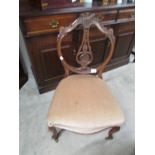 A mahogany nursing chair.