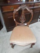 A mahogany nursing chair.