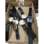 A collection of watches and a pocket watch.