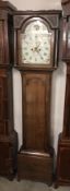 An oak cased 8 day long case clock with painted arched dial, 'Thos. Peasford, Berwick'.