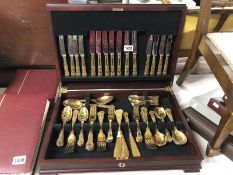 A gold plated canteen of cutlery.