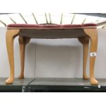 A dressing table stool with Queen Anne legs
