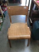 A vintage wooden school chair.