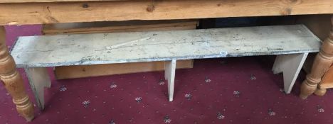 A vintage painted long bench stool.