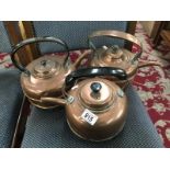 3 copper kettles.